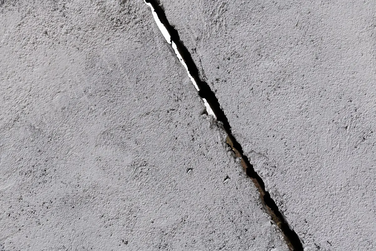 Gray concrete wall with crack