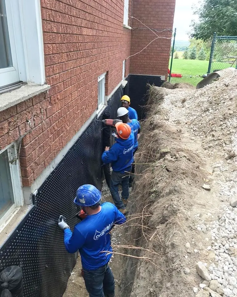 Exterior basement waterproofing Toronto project by Dryshield showing excavation and weeping tile installation.