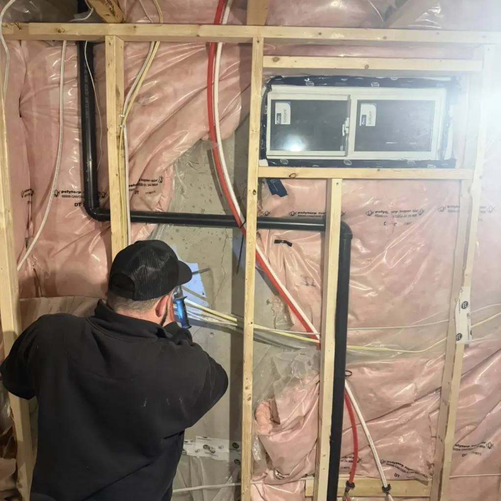 Foundation Crack Repair Technician repairing basement foundation crack in Toronto home.