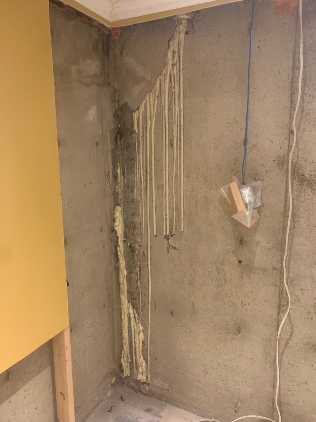 Basement corner crack after re-injection with polyurethane resin over a failed earlier repair