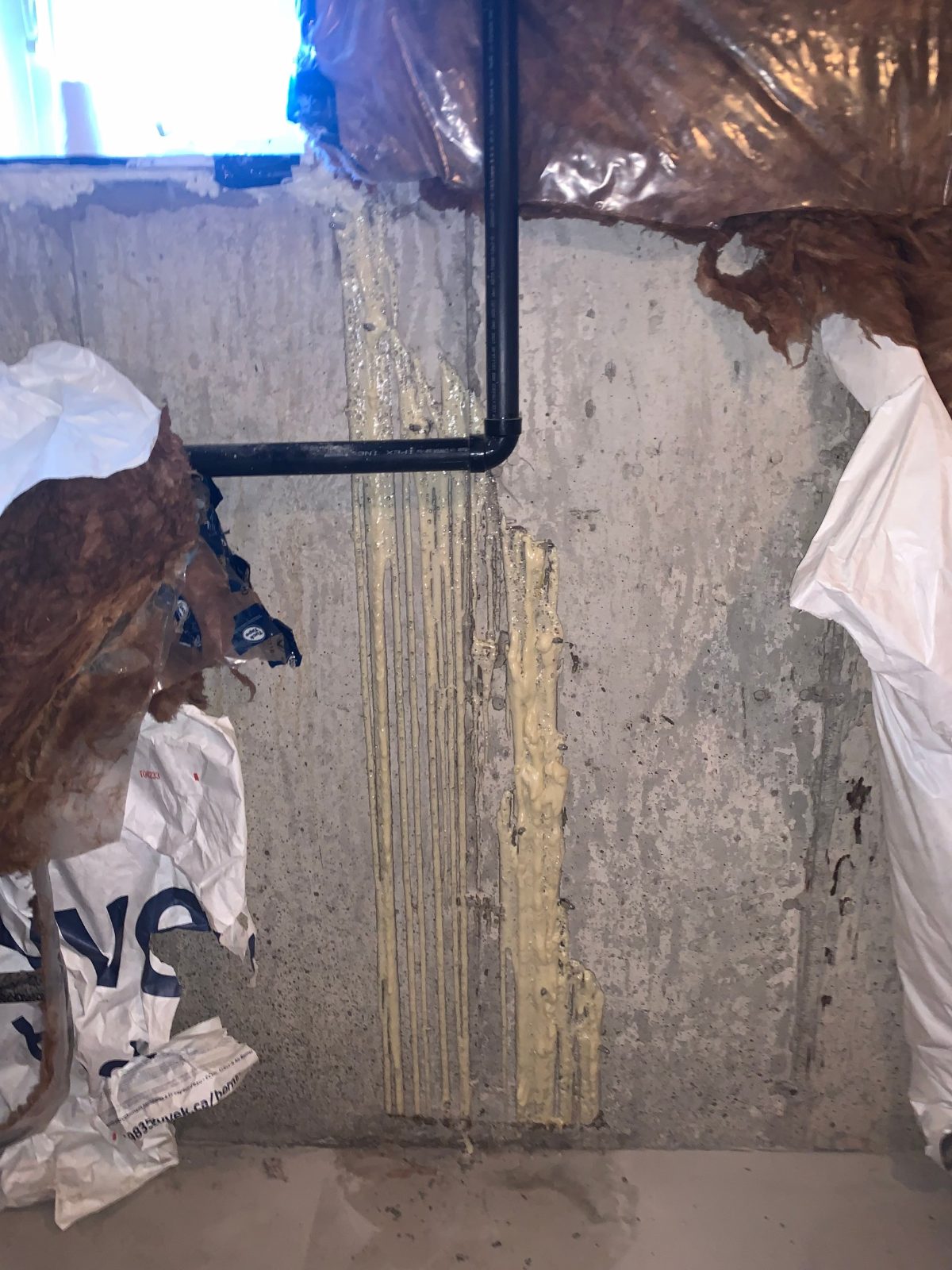 Poured concrete basement wall cracks after polyurethane crack injection